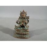 Buddha - A Chinese Tibetan bronze Buddhist figure depicting Avalokiteshvara, approximately 8.
