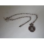 A hallmarked Silver double Albert watch chain with fob