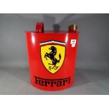 A red metal petrol can marked Ferrari