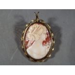 A 9ct gold mounted cameo brooch / pendant, 8.85 grams total weight.