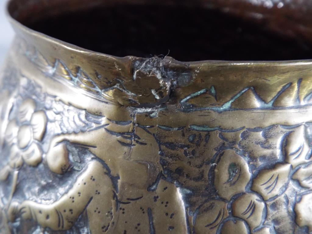 A middle eastern gilt bowl with repoussé decoration depicting fauna and mythical creatures, - Image 6 of 8