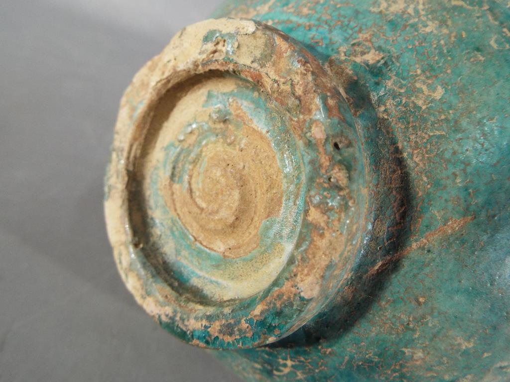 A rare middle eastern turquoise glazed jug of waisted globular form with elongated pouring spout, - Bild 7 aus 8