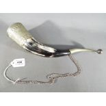 A huntsman's Drinking Horn, with white metal mounts and safety chain, approx 38 cm long.