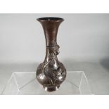 A Japanese bronze vase with elongated trumpet neck,