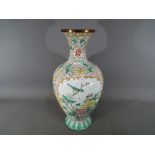 A Chinese enamelled vase with floral and
