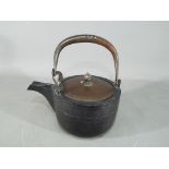 A Meiji period cast iron tetsubin, the b