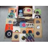 A collection of 45 RPM vinyl records to include The Beatles, The Rolling Stones, Rod Stewart,