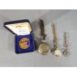 A solid bronze coin, The Tower Mint in presentation case, a modern pocket watch a chain,