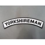 A cast iron sign entitled Yorkshire Man [YYORK] This lot must be paid for and removed no later than