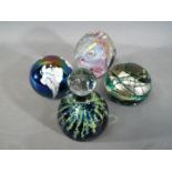 Paperweights - Four glass dome paperweights to include Mdina, studio glass,