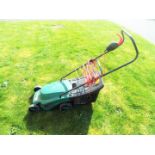 A Qualcast Cobra 32 electric lawnmower.