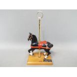 A PJ's Carousel Collection, Dentzel style model mounted on wooden plinth,