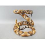 Country Artists - A Country Artists model depicting a coiled rattle snake,