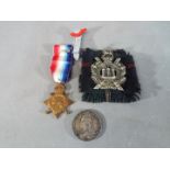 Military - a mixed lot to include The Kings own Scottish Borderers regiment cap badge,