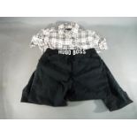 Clothing - a lady's Burberry shirt, size L and a pair of Hugo Boss black casual trousers,