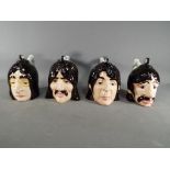 Lorna Bailey - a set of four large collectable novelty teapots in the form of 'The Beatles'.