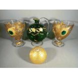 A matched pair of ornamental glass goblets impressed with gold leaf,