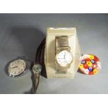 A gentleman's Lorus wristwatch (boxed), Oris fob watch, Roamer lady's wristwatch and a paperweight.