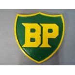 A large cast iron BP sign approximately 34 cm x 33 cm.