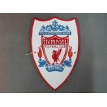 A cast iron wall plaque marked Liverpool Football Club.