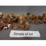 Approximately seventy bear figurines contained in two boxes.
