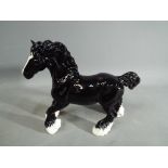 Beswick Pottery - a collector's club figurine in the form of a Cantering Shire Horse.