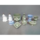 A quantity of Wedgwood Jasper Ware in powder blue and green and two Royal Doulton International