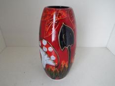 Anita Harris - a tall vase decorated with depictions of toadstools, signed to the base,