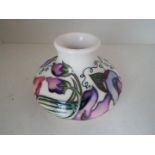 Moorcroft Pottery - a squat vase decorated in the 'Sweetness' pattern, 7.