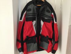 A gentleman’s good quality red and black biker’s jacket by JTS Biker Clothing with padded shoulders,