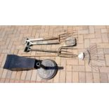 A mixed lot of gardening tools, four modern planters and a cast iron parasol stand.