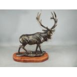 A cast figure of a stag measuring approximately 49 cms in height.