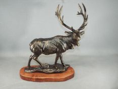 A cast figure of a stag measuring approximately 49 cms in height.