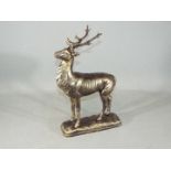 A cast figure of a deer on a base, standing approximately 30 cms in height.