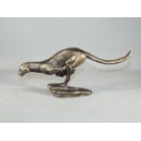 A cast figure of a Cheetah running,