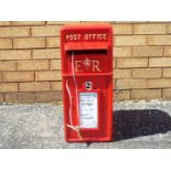 A cast iron post box in the form of a Royal Mail post box.