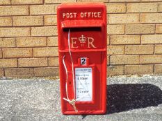 A cast iron post box in the form of a Royal Mail post box.