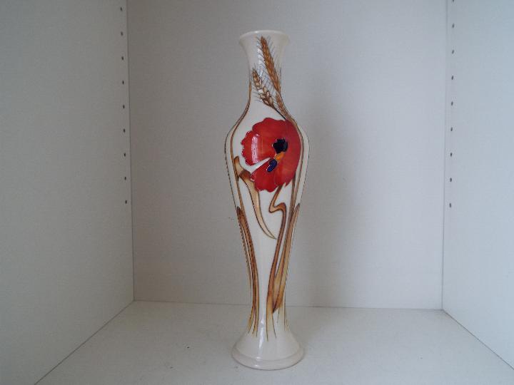 Moorcroft - a tall slender vase decorated in the Harvest Poppy pattern, approximately 30 cm (h),