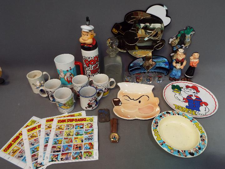 Popeye - A mixed lot of Popeye related collectables to include decanter, mugs, bowls, cups,