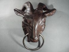 A cast goat head with ring (xgoat)