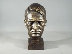 A cast bust depicting Hitler measuring 21cm (H) x 10cm (W) x 13cm (D) (xhibz)
