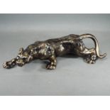 A cast iron lion figure.