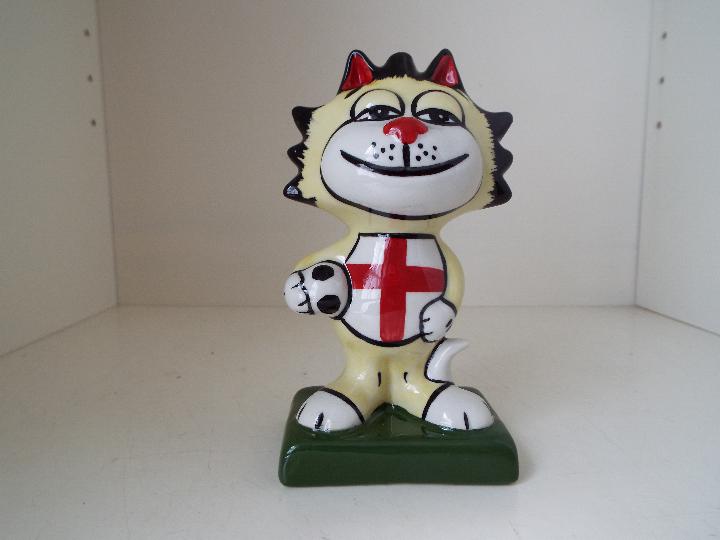 Lorna Bailey - a figurine depicting an England Football Cat, signed to the base, 13.