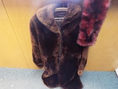 A lady's 3/4 length fur coat (vendor states that coat is beaver fur) , slip pockets,