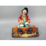 Royal Doulton - a rare early figurine entitled 'In the Stocks' HN2163, approx 15 cm (high),