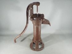 A cast garden pump measuring approximately 50 cms in height.