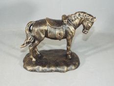 A cast figure of a horse on a base measuring approximately 16 cms in height.