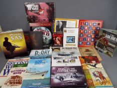 A collection of military related books and DVD's.