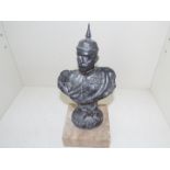 World War One (WW1) - an early white metal sculpture depicting an officer in dress uniform with