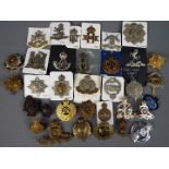 A collection of military cap badges and similar.